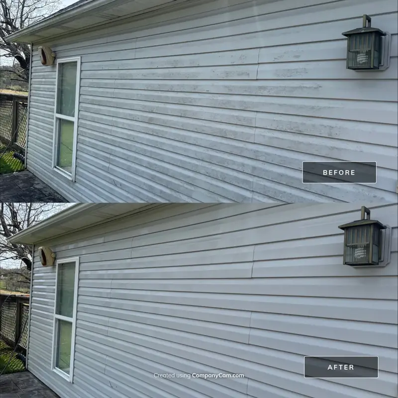 Vinyl siding under a porch light before and after house washing